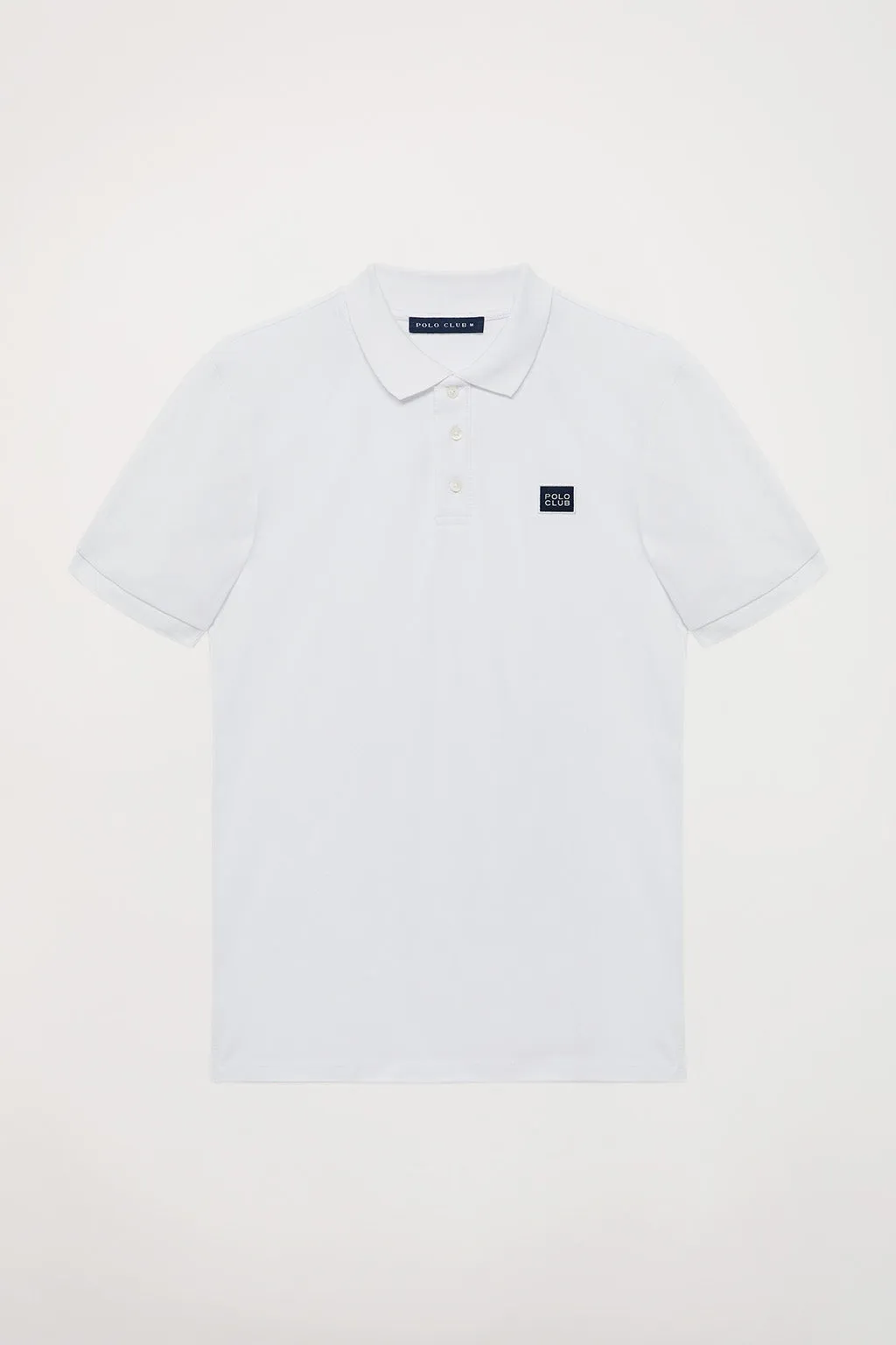 Polo blanco piqué con tapeta de tres botones y detalle Polo Club